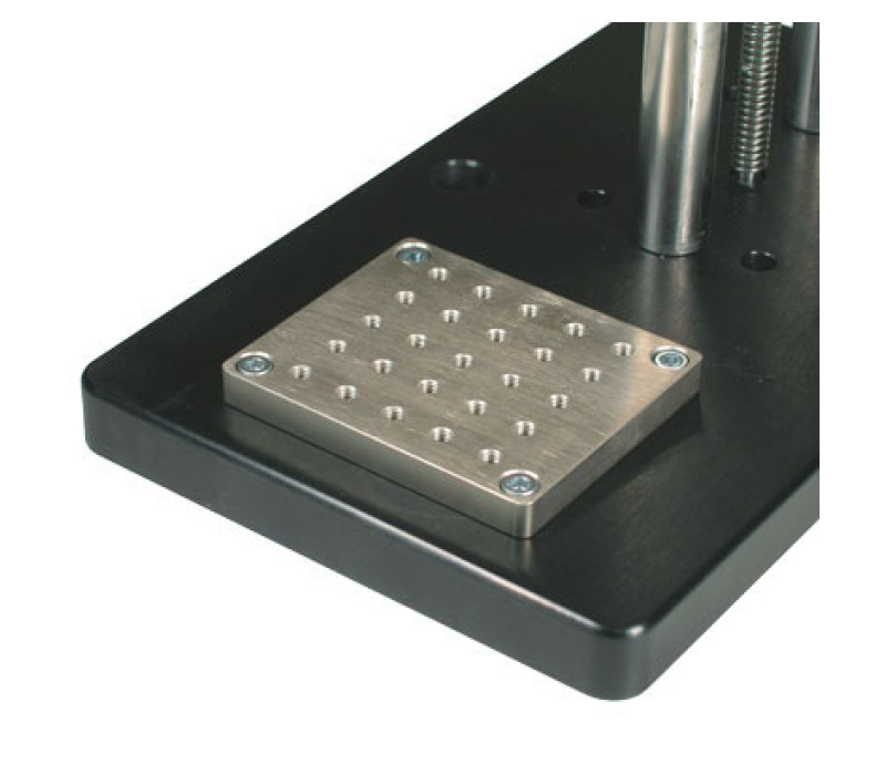Optional AC1060 mounting plate contains a matrix of threaded holes for grip and fixture mounting.