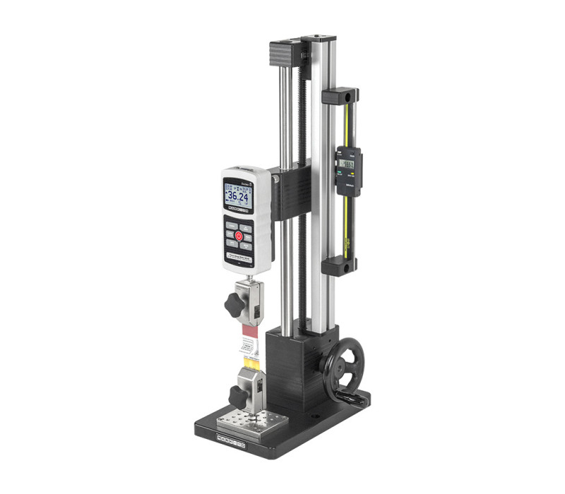The ES30 manual test stand features an ergonomic side-mounted handwheel and 1 kN capacity. Shown here with a Series 5 digital force gauge and pair of G1008 film &amp; paper grips. And equipd with the optional 150mm digital travel display ESM001

