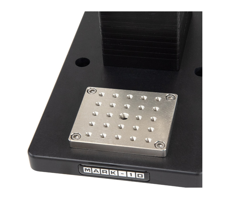 The AC1060 mounting plate contains a matrix of threaded holes for grip and fixture mounting.