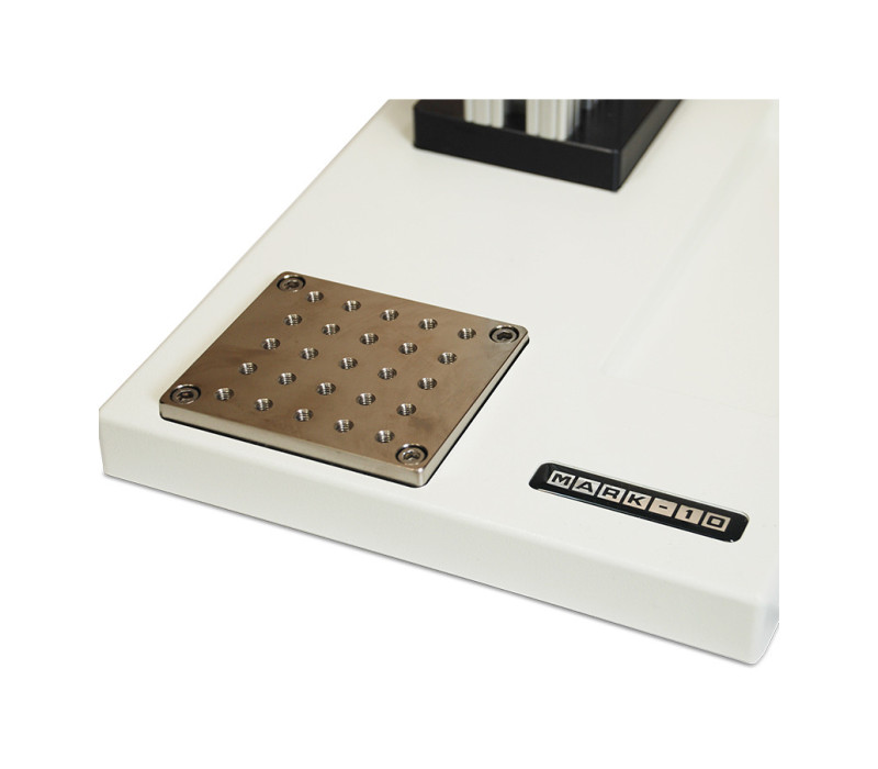 Mounting plate contains a matrix of threaded holes for grip and fixture mounting.