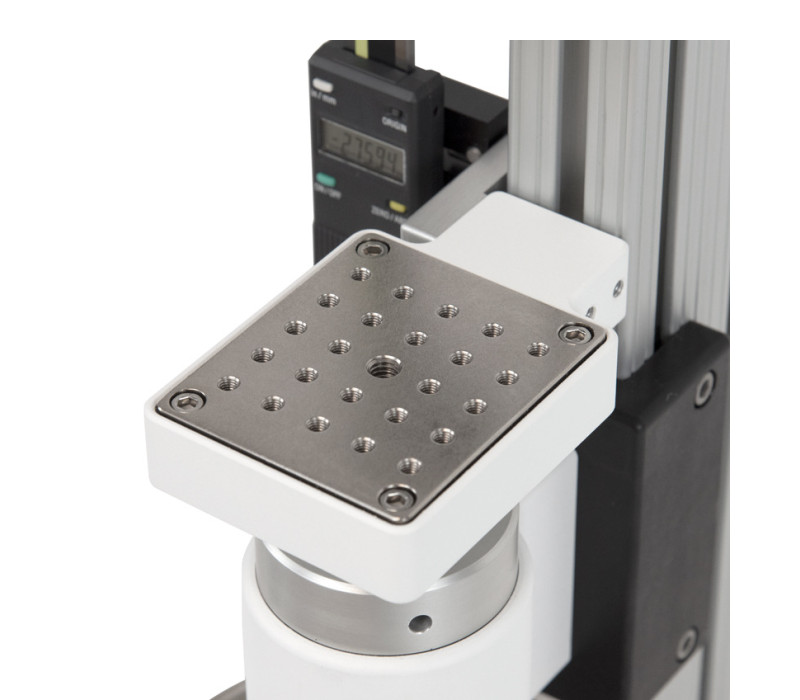 Mounting plate contains a matrix of threaded holes for grip and fixture mounting.