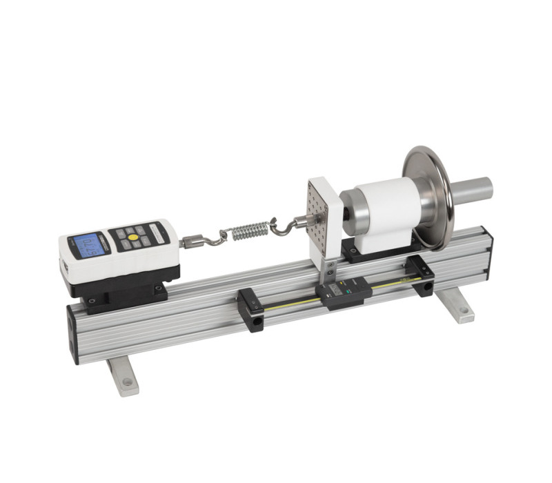 The TSC1000H horizontal test stand is shown in a tension spring testing application with a Series 5 digital force gauge, set of hooks, and optional digital travel display.