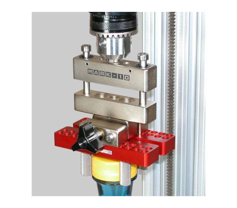 Optional axial compensator allows for vertical movement in the sample during a torque test.