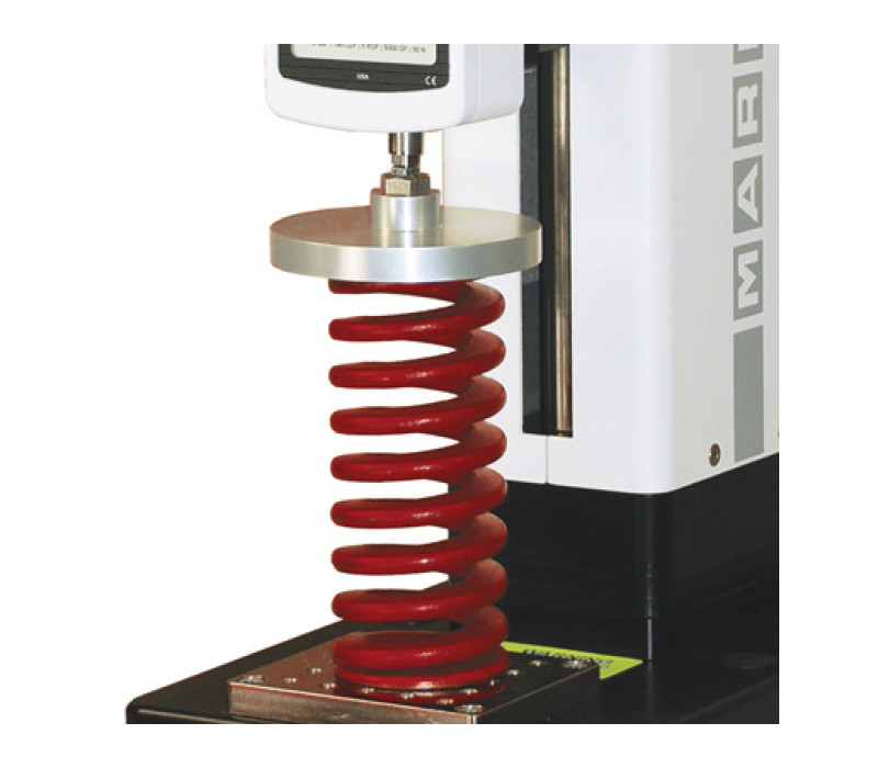 G1009-1 compression plate shown in a typical spring testing application with an ESM301 test stand and Series 5 digital force gauge.