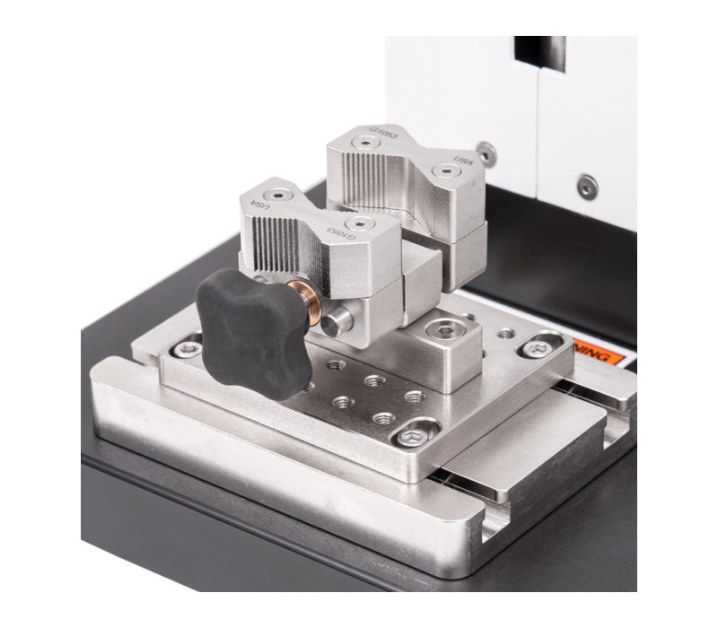 G1053 is shown mounted to the base plate of an ESM303 with a G1055 adapter