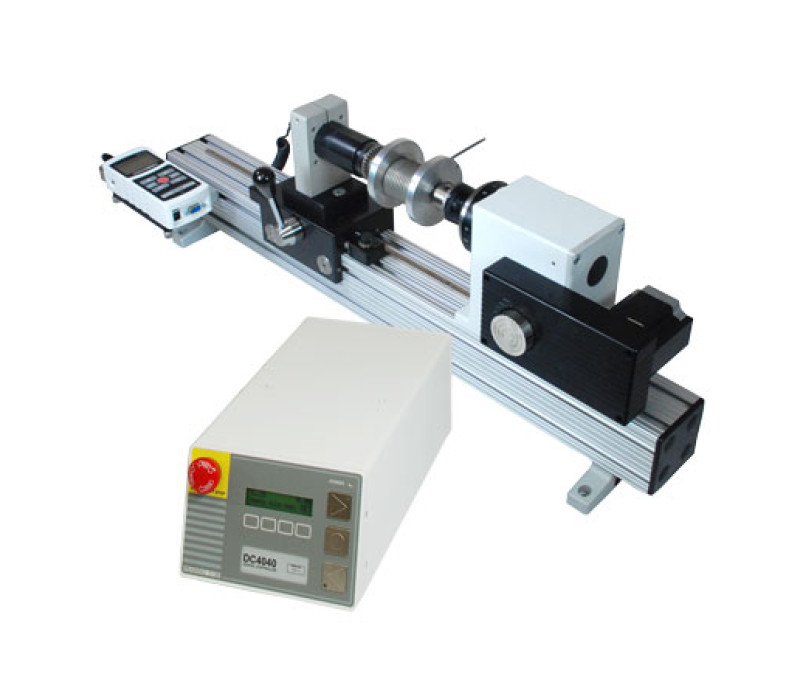 The TSTMH-DC horizontal advanced motorized torque test stand is shown in a torsion spring testing application.