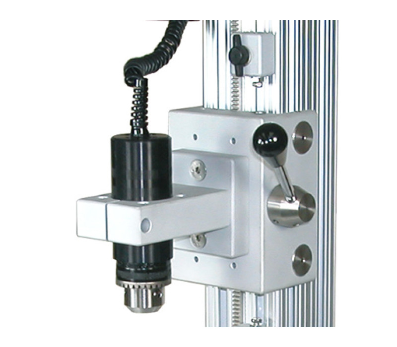 A Series R50 torque sensor is shown mounted to a model TSTM-DC motorized torque test stand. The sensor fits into this stand without the need for additional adapters.