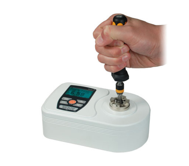 To operate the TT02 torque tester, simply place the torque tool into the universal receptacle and twist. The readout will show the real time or peak torque value in the clockwise or counterclockwise direction. Shown here witha manual torque tool.