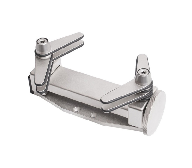 The optional G1023 bottle grip is a flexible solution for many torque applications. Two sets of 4 rubber-edged gripping arms may be independently adjusted in 45° increments to accommodate a variety of bottle shapes and sizes.