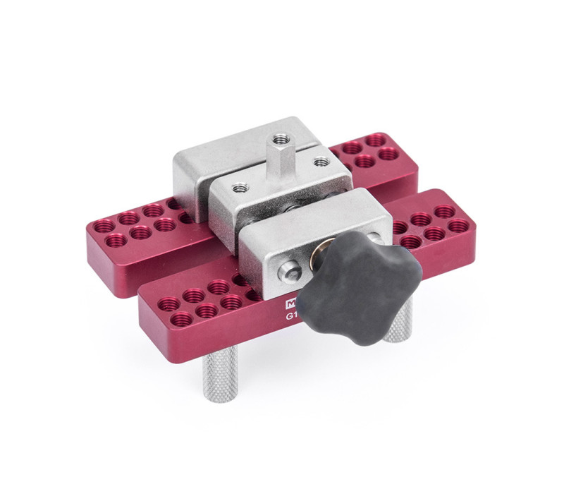 The optional G1058 is a universal grip for pull testing and torque testing applications. Adjustable serrated metal posts accommodate a variety of sample shapes and sizes.