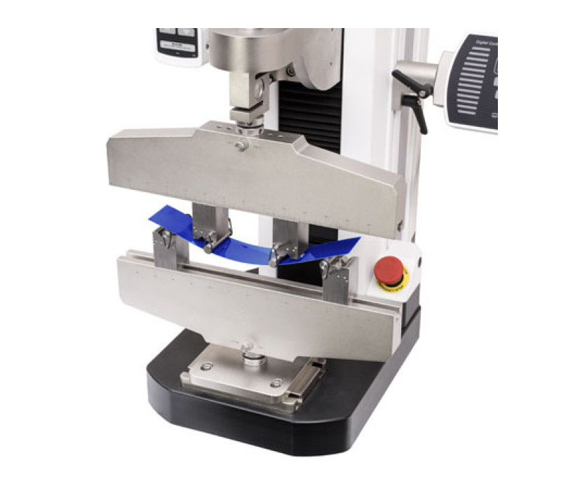 A typical 4-point bend testing application, including two G1096 base fixtures, mounted to a motorized test stand.