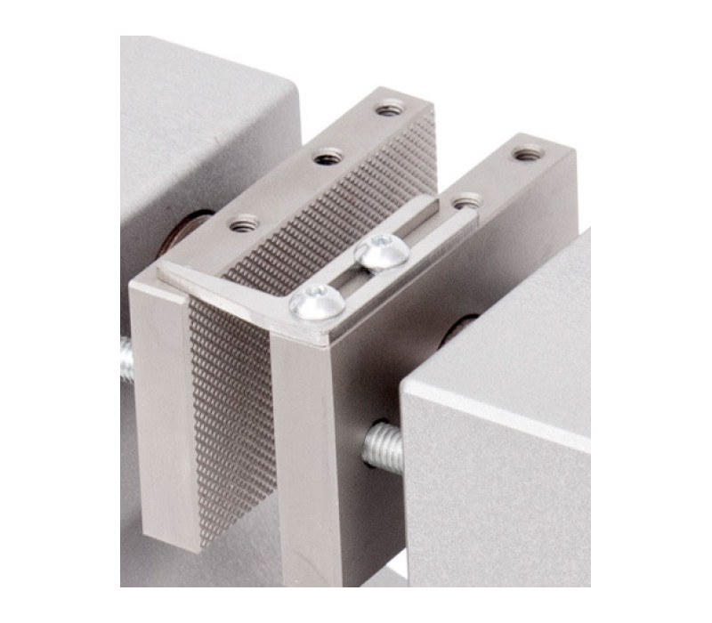Adjustable stop ensures consistent sample placement