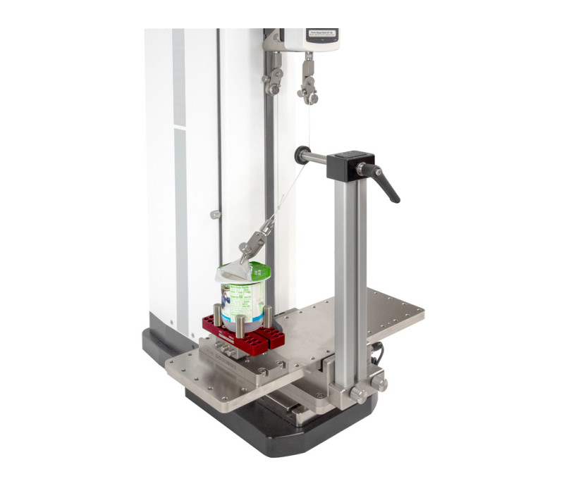 G1109 shown in a peel test with optional AC1078 adjustable angle fixture, G1058 bottle grip, and AC1080 grip adaptoer. G1003 miniature component grip secures the foil tab.