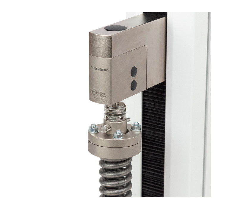 G1123 is shown in a typical application with low-deflection compression spring. Adjust the four screws and nuts to ensure full engagement with the top of the sample.