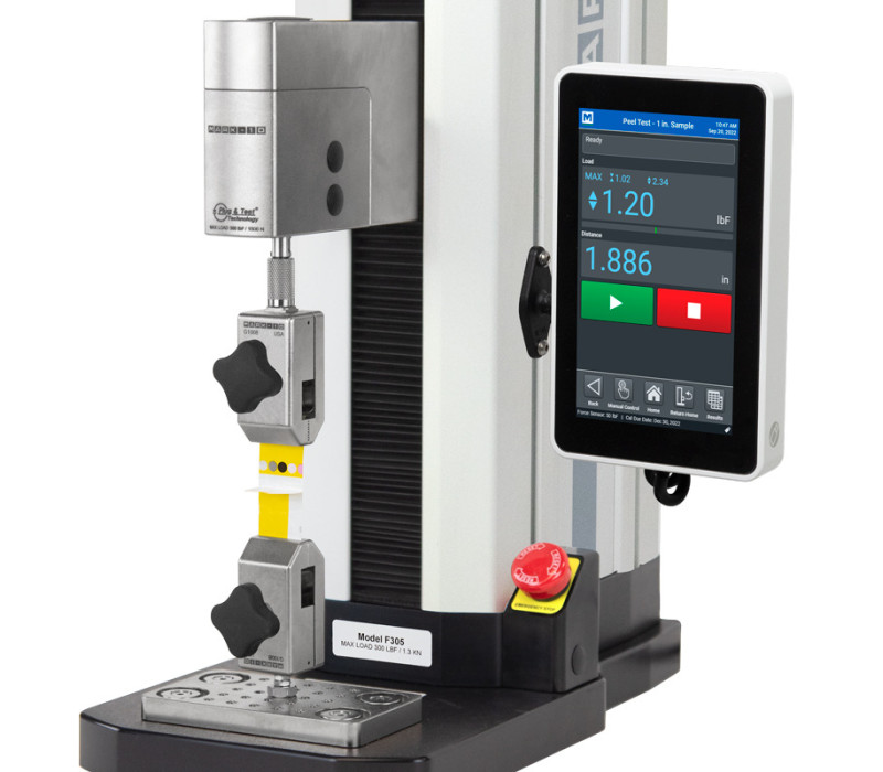 An F305-EM Test Stand shown configured for a vertical peel test with two G1008 Film & Paper Grips.