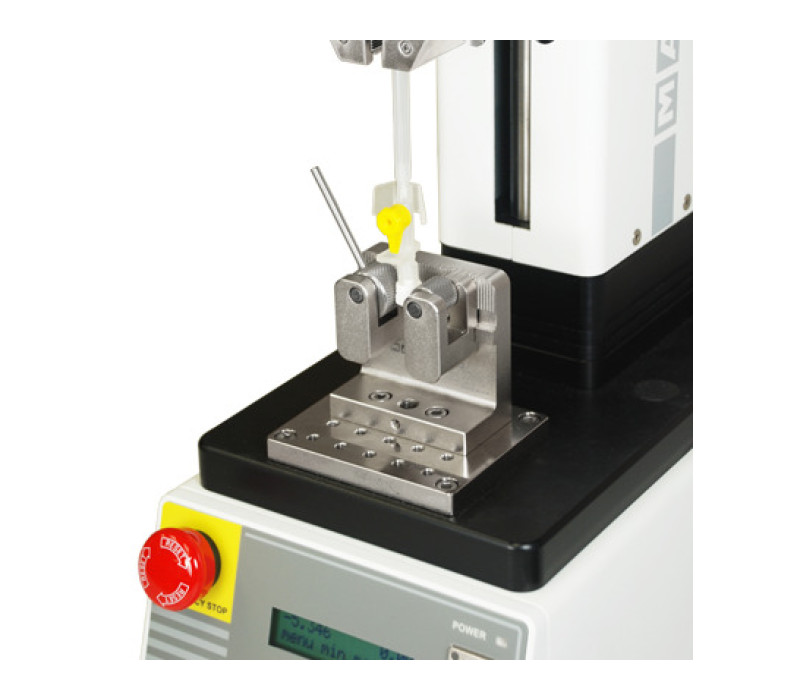G1085 and G1061 wedge grip shown mounted to a motorized test stand for a medical device pull testing application.