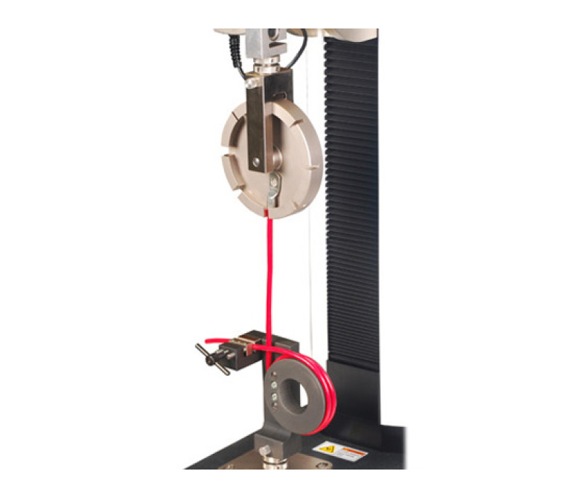 A typical wire terminal pull test. The G1092 grip is used in combination with a G1093 wire terminal grip, mounted to an ESM1500LC motorized test stand.