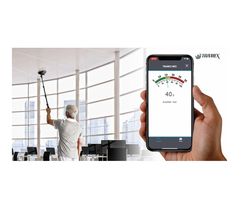 Tramex Gauge used on a ceiling with the extension handle connected to the app